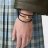 Bracelet Pebble en cuir de veau noir/doré