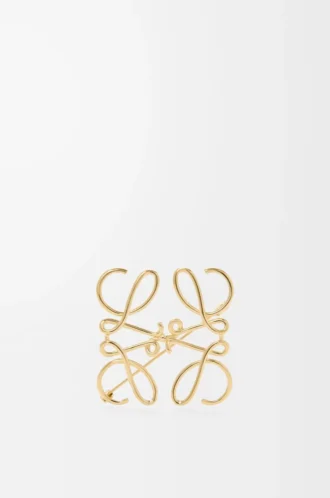 Broche Anagram en métal doré