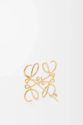 Broche Anagram en métal doré