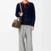 Cardigan polo en laine bleu marine/orange