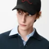 Casquette avec patch L en coton noir