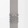 Ceinture réversible Anagram en cuir de veau lisse Tan/Gris asphalte/Étain