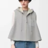 Gilet à capuche en peau lainée gris clair mélangé Gilet à capuche en peau lainée gris clair mélangé