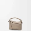 Mini sac Puzzle Edge en cuir de veau grainé souple Clay Mini sac Puzzle Edge en cuir de veau grainé souple Clay