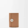 Petit portefeuille vertical Pebble en cuir de veau grainé Pebble Moka
