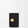 Petit portefeuille vertical Pebble en cuir de veau nappa brillant Black