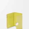 Petit portefeuille vertical Pebble en cuir de veau nappa brillant Light Citrine