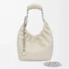 Petit sac Squeeze en cuir d&rsquo;agneau nappa souple, couleur sel de mer