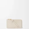 Porte-cartes et porte-monnaie Knot en cuir de veau nappa brillant Light Oat Porte-cartes et porte-monnaie Knot en cuir de veau nappa brillant Light Oat