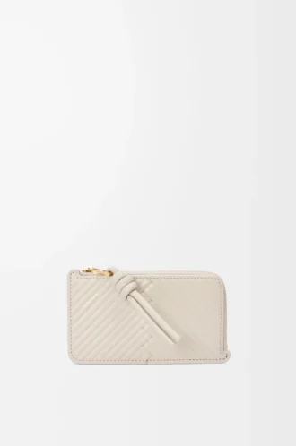 Porte-cartes et porte-monnaie Knot en cuir de veau nappa brillant Light Oat