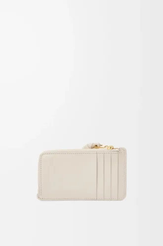 Porte-cartes et porte-monnaie Knot en cuir de veau nappa brillant Light Oat