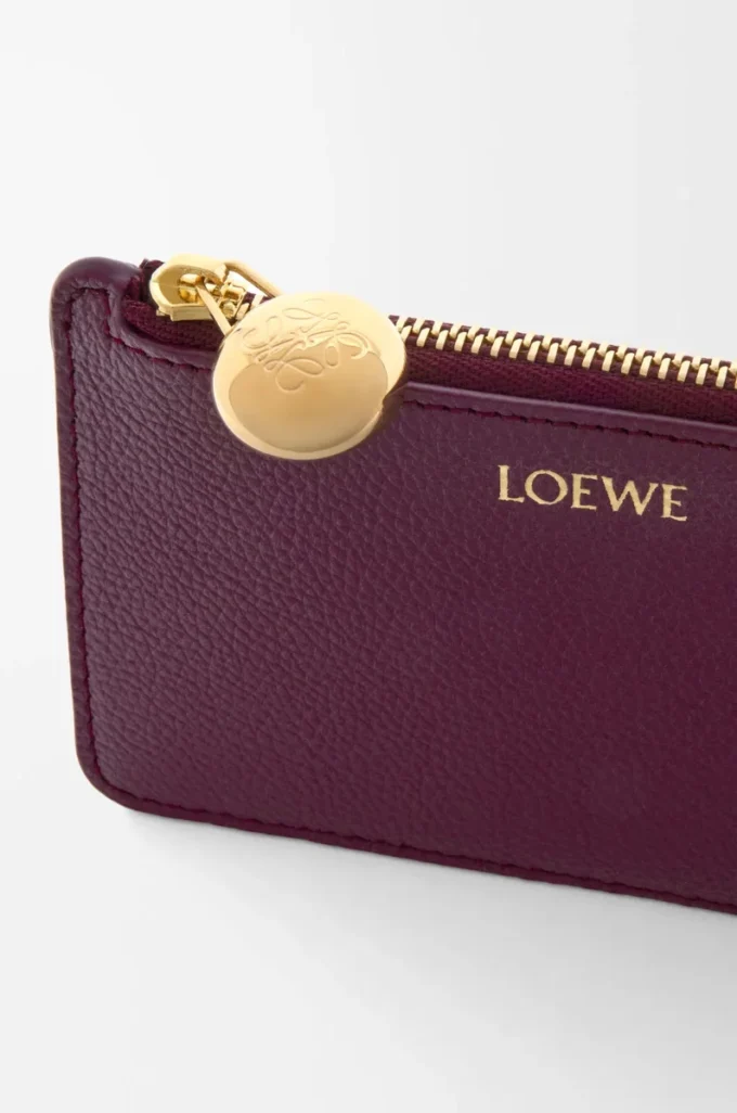 Porte-monnaie et cartes en cuir de veau grainé Pebble, couleur Prune Porte-monnaie et cartes en cuir de veau grainé Pebble, couleur Prune