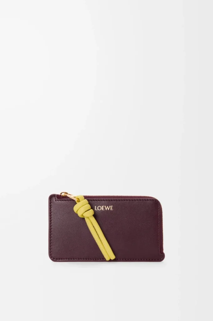 Porte-monnaie Knot en cuir de veau nappa brillant Dark Burgundy/Light Citrine Porte-monnaie Knot en cuir de veau nappa brillant Dark Burgundy/Light Citrine