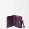 Portefeuille compact Knot en cuir de veau nappa brillant Clay/Plum