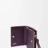 Portefeuille compact Knot en cuir de veau nappa brillant Clay/Plum