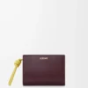 Portefeuille compact Knot en cuir de veau nappa brillant Dark Burgundy/Light Citrine Portefeuille compact Knot en cuir de veau nappa brillant Dark Burgundy/Light Citrine