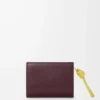 Portefeuille compact Knot en cuir de veau nappa brillant Dark Burgundy/Light Citrine Portefeuille compact Knot en cuir de veau nappa brillant Dark Burgundy/Light Citrine