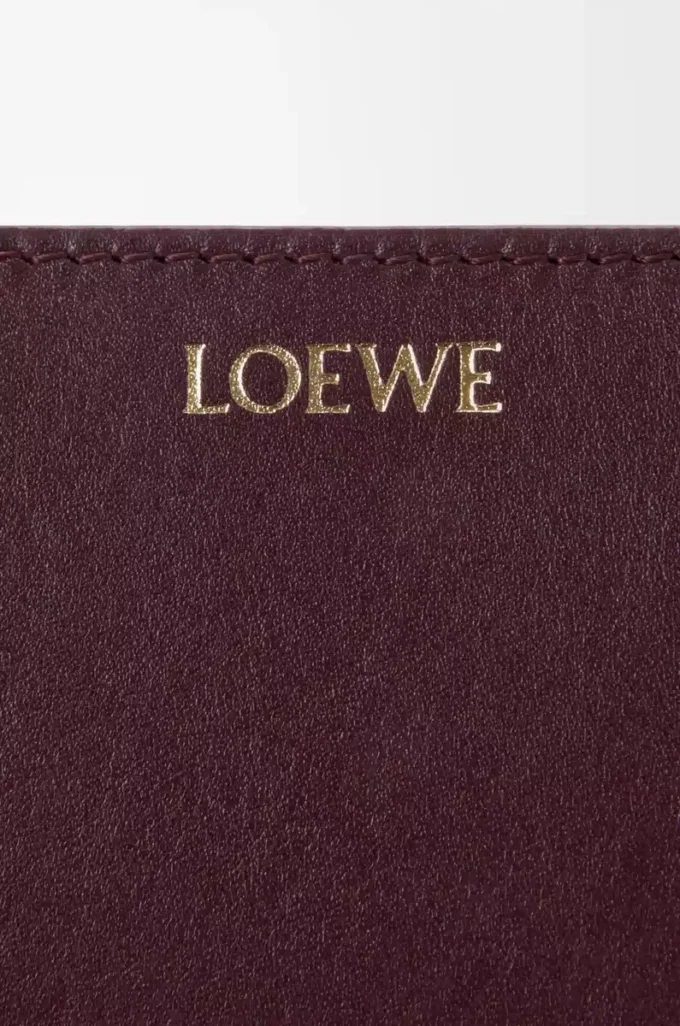 Portefeuille compact Knot en cuir de veau nappa brillant Dark Burgundy/Light Citrine Portefeuille compact Knot en cuir de veau nappa brillant Dark Burgundy/Light Citrine