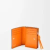 Portefeuille compact Knot en cuir de veau nappa brillant Noir/Orange vif