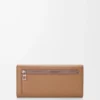 Portefeuille continental Pebble en cuir de veau mini grain Moka