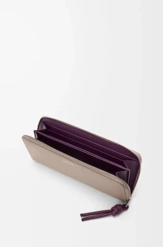 Portefeuille zippé à nœud en cuir de veau nappa brillant Clay/Plum