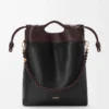 Sac à main Flamenco en cuir d’agneau nappa souple Noir/Marron foncé Sac à main Flamenco en cuir d’agneau nappa souple Noir/Marron foncé