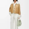 Veste en peau lainée blanche/dorée