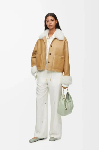Veste en peau lainée blanche/dorée