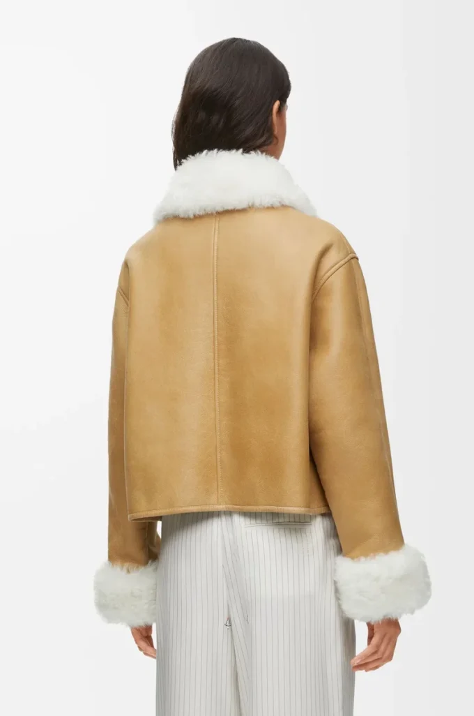 Veste en peau lainée blanche/dorée